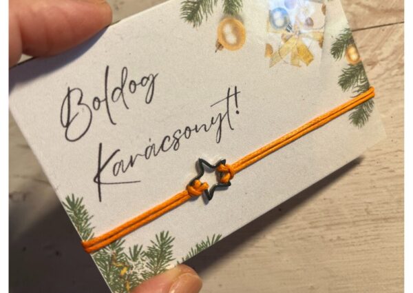 Narancssárga karkötő rozsdamentes acél csillaggal, "Boldog Karácsonyt!" feliratos laminált kártyával